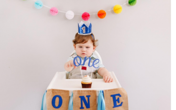 Baby in high chair first birthday decoration 