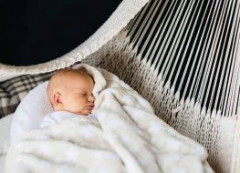 baby hammock for crib - baby sleeping on a white woven hammock