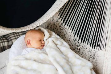 baby hammock for crib - baby sleeping on a white woven hammock