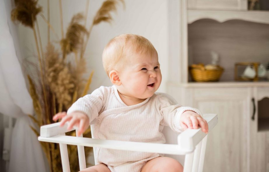 white wooden baby chair 