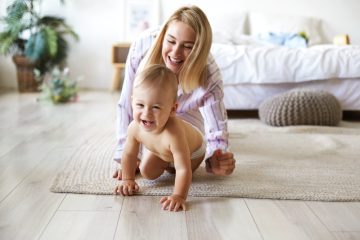 baby crawling with parent
