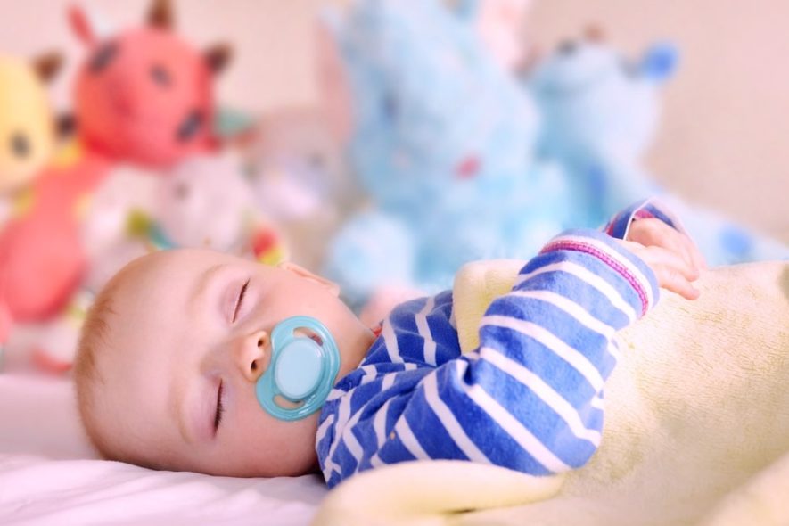 baby sleeping with pacifier